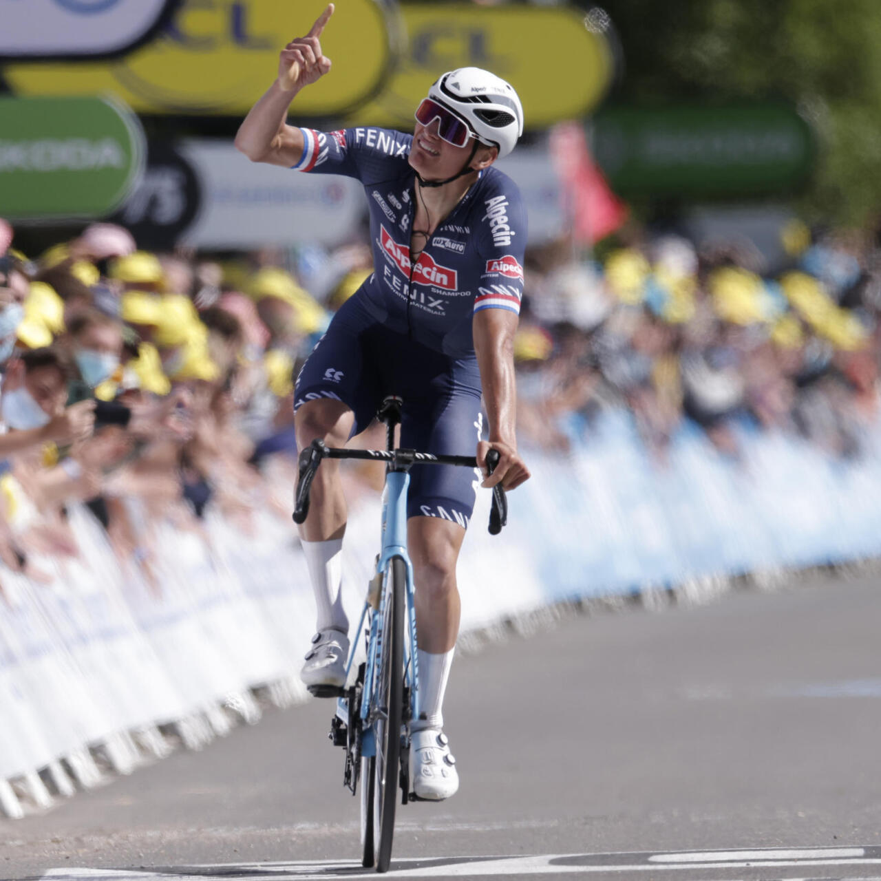 Mathieu van der Poel pointing to the sky as remembering his late grandfather, the great Raymound Poulidor, as he arrives in the finish of Stage 2 of Tour de France 2021 on 27 June 2021