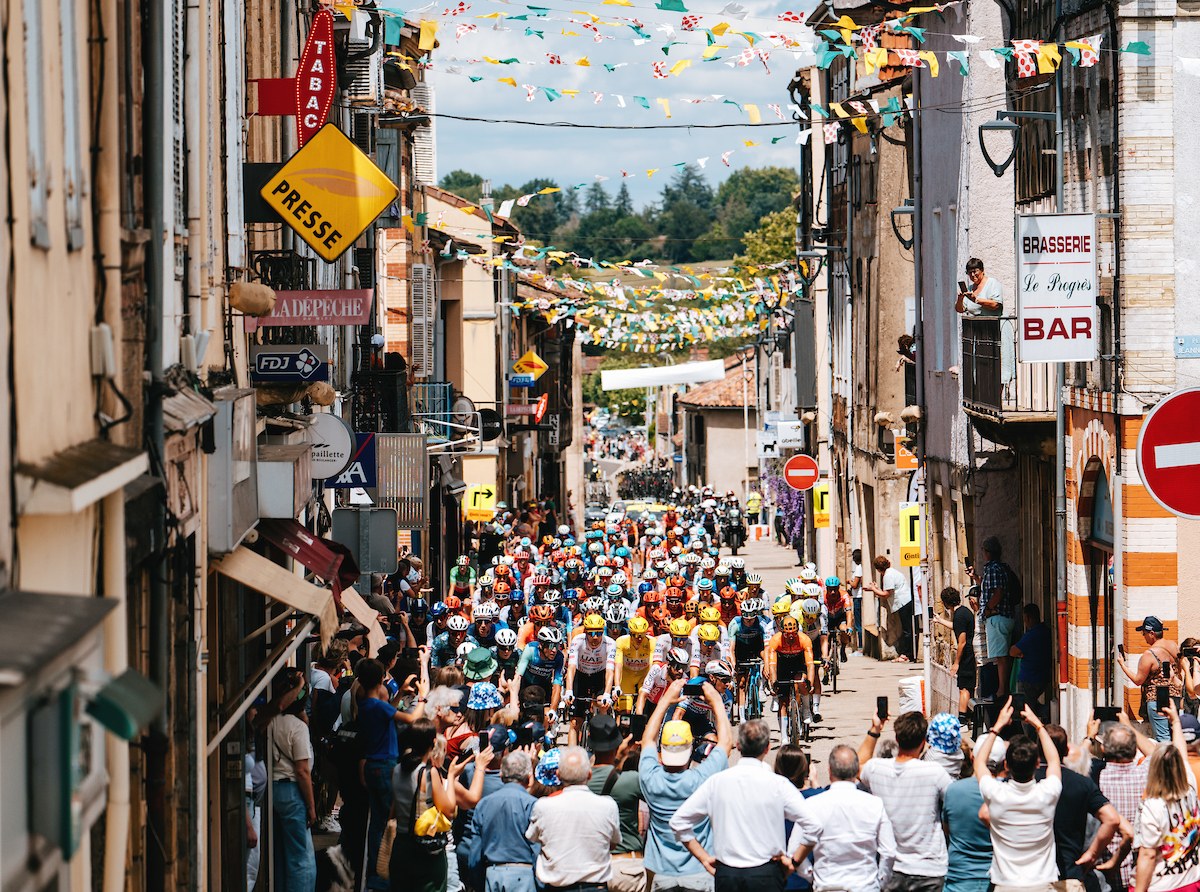 Small communities celebraring Tour de France, cyclists and themselves. A moment from the 13th stage of Tour de France 2024