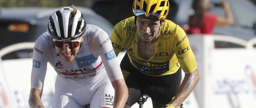 Tadej Pogacar in white jersey, Primoz Roglic in yellow jersey climbing together Col de La Loze during the Tour de France 2020